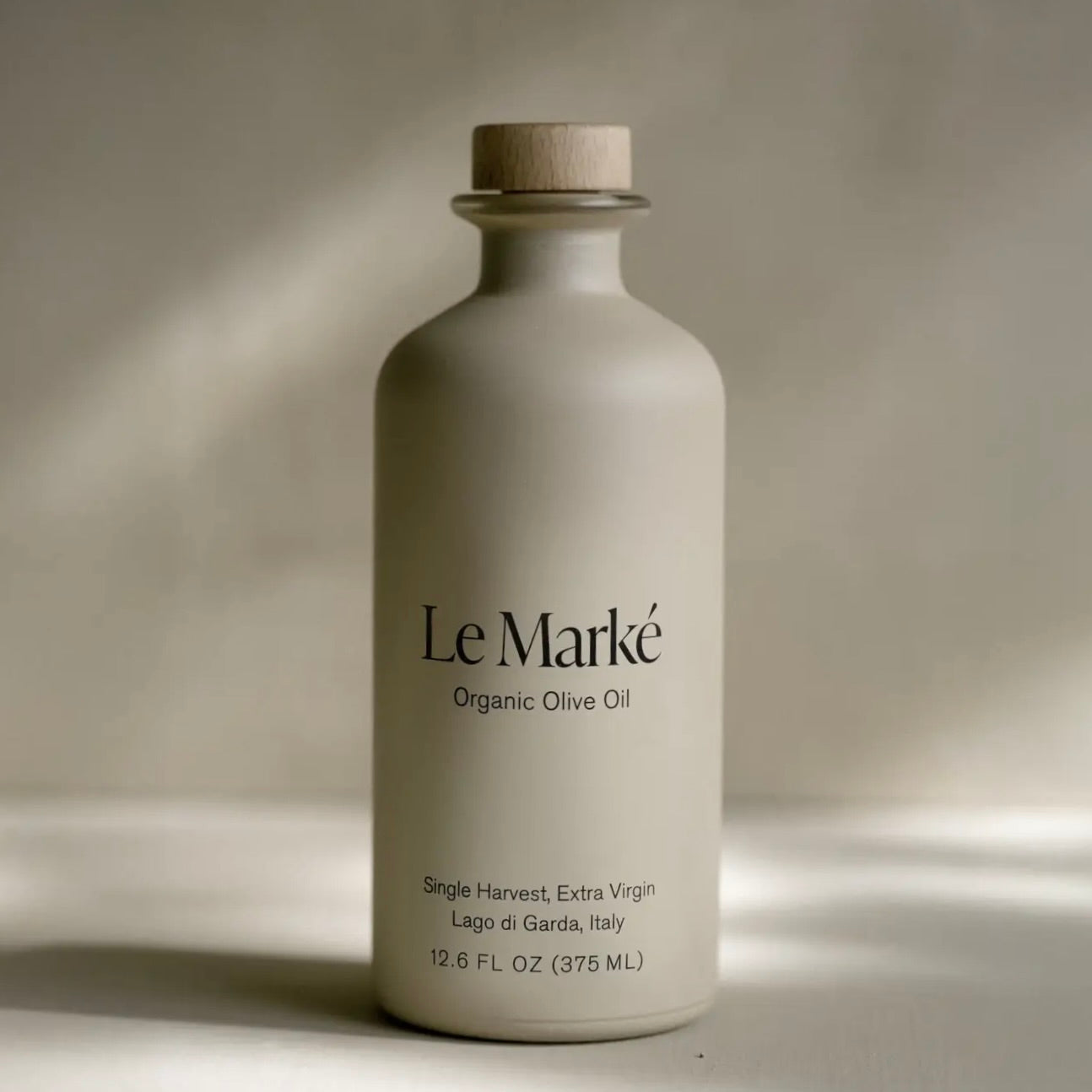 Le Marké Organic Olive Oil bottle on a neutral background