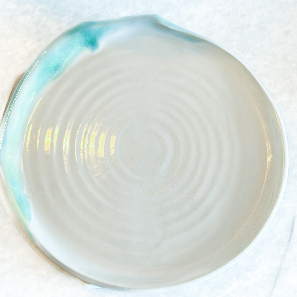 white ceramic plate with green accent color