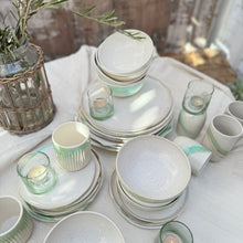 Load image into Gallery viewer, white ceramic dishes with brown speckles and green and brown glaze accents