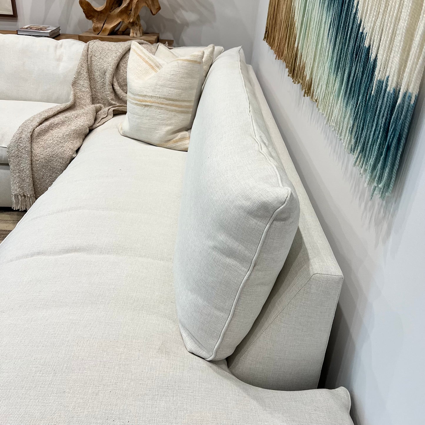 white 2 piece sectional sofa, with one part chaise, one part with left facing arm