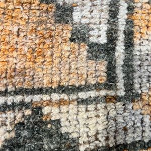 vintage runner rug with orange, rust, dark gray and off white colors with geometric pattern