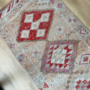 vintage Turkish runner rug with red, pink, cream and off white and gray colors