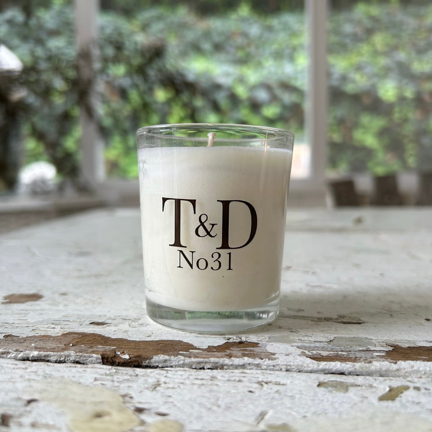 clear glass votive with clear label logo
