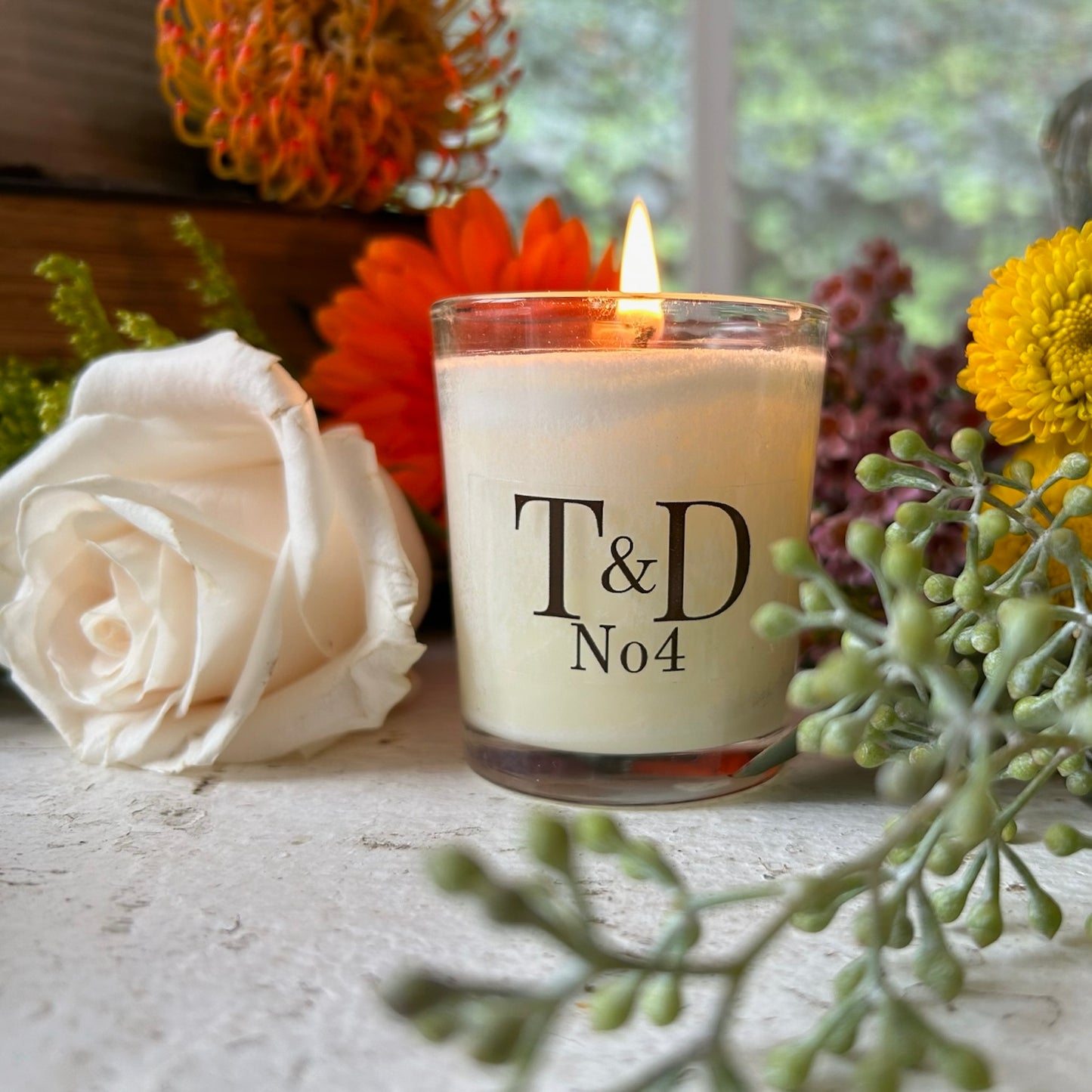 clear glass votive with clear label logo