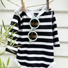 Load image into Gallery viewer, light blue toddler sunglasses hanging on a black and white striped long sleeve baby retro swimsuit