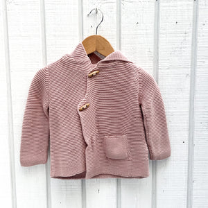 rose pink colored baby sweater with hood, small pocket and two wood toggle buttons