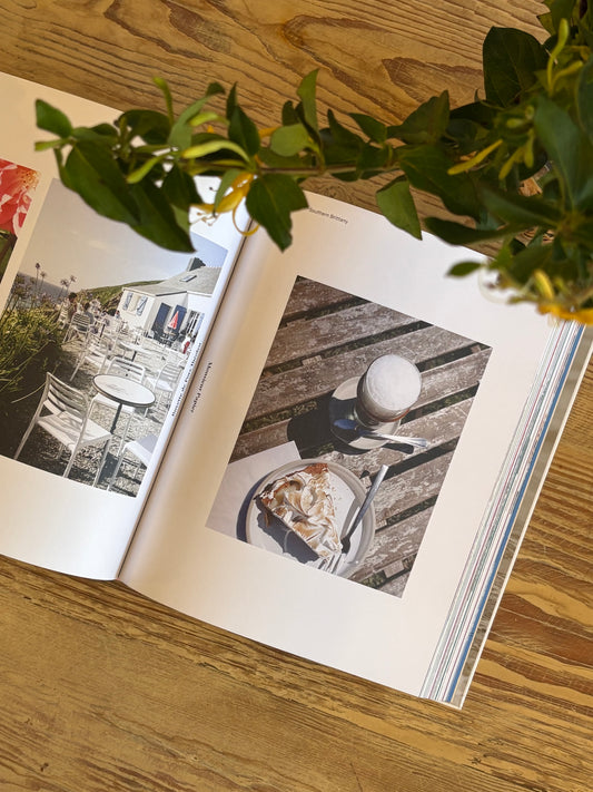 open page of a book with a plate of food on a good table