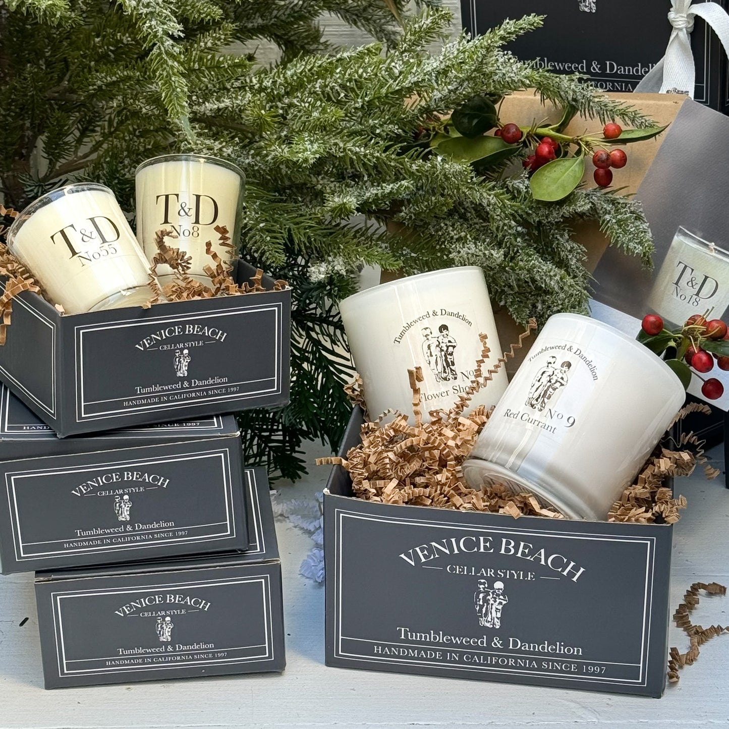 glass candles displayed in dark gray Tumbleweed custom boxes
