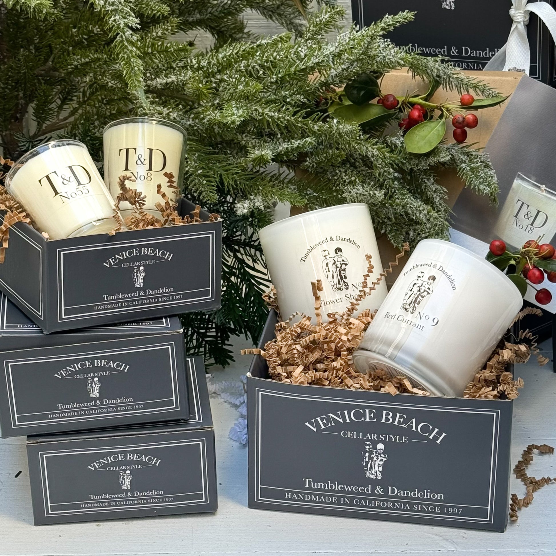 glass candles displayed in dark gray Tumbleweed custom boxes