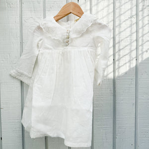 white cotton toddler dress with long sleeves and collar