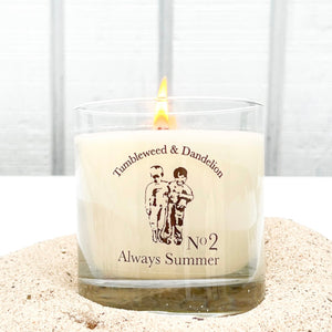 clear glass candle with Tumbleweed logo in blackALWAYS SUMMER clear candle with black Tumbleweed & Dandelion logo