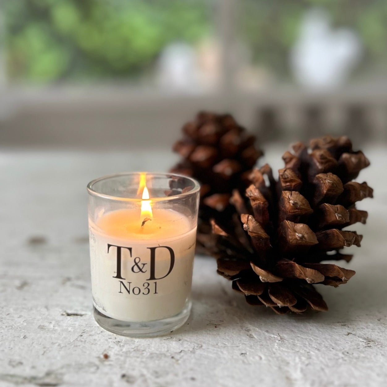 clear glass votive with clear label logo