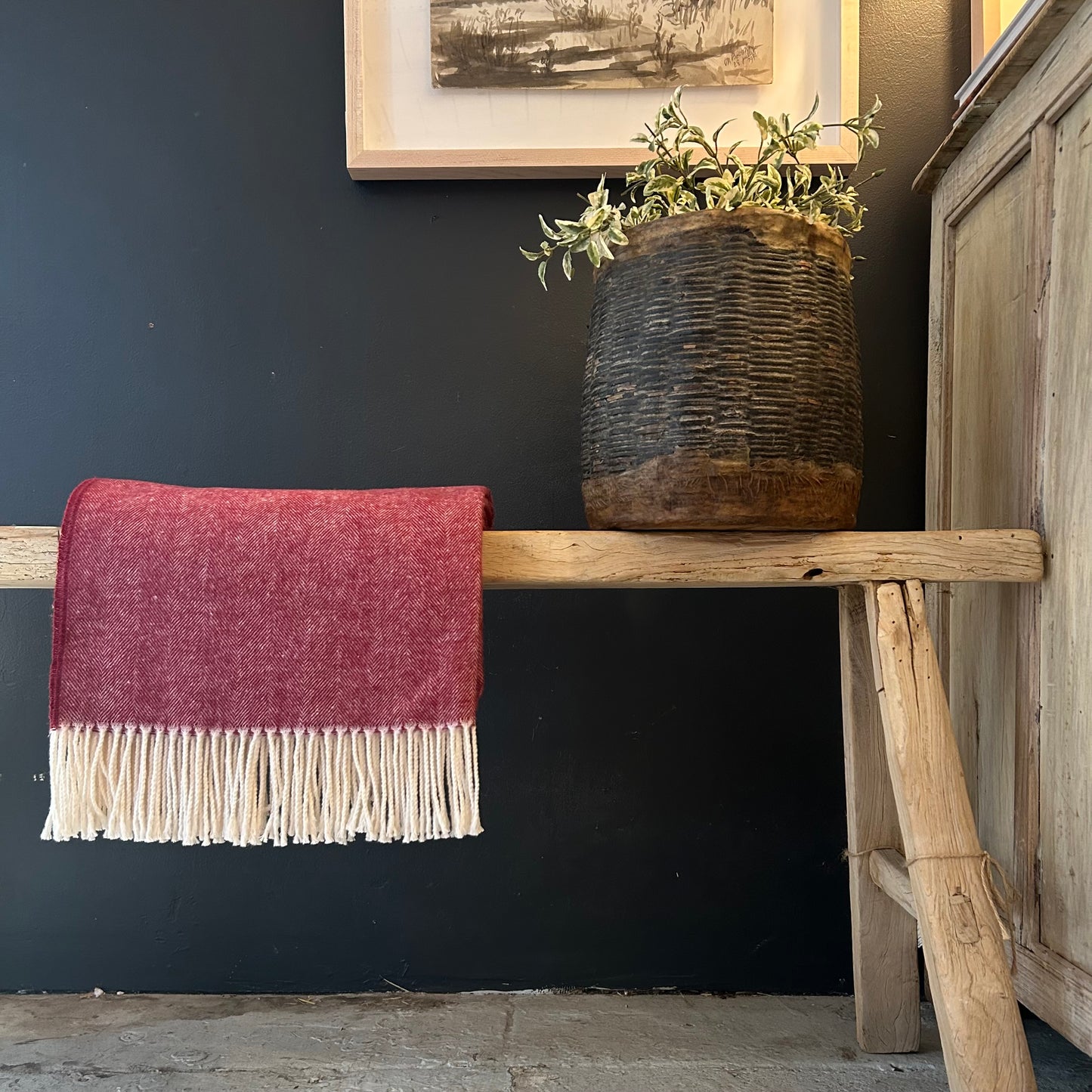 cranberry colored herringbone throw with cream colored fringe