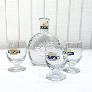 vintage French Ricard clear glass bottle with three short stemmed glasses with Ricard logo