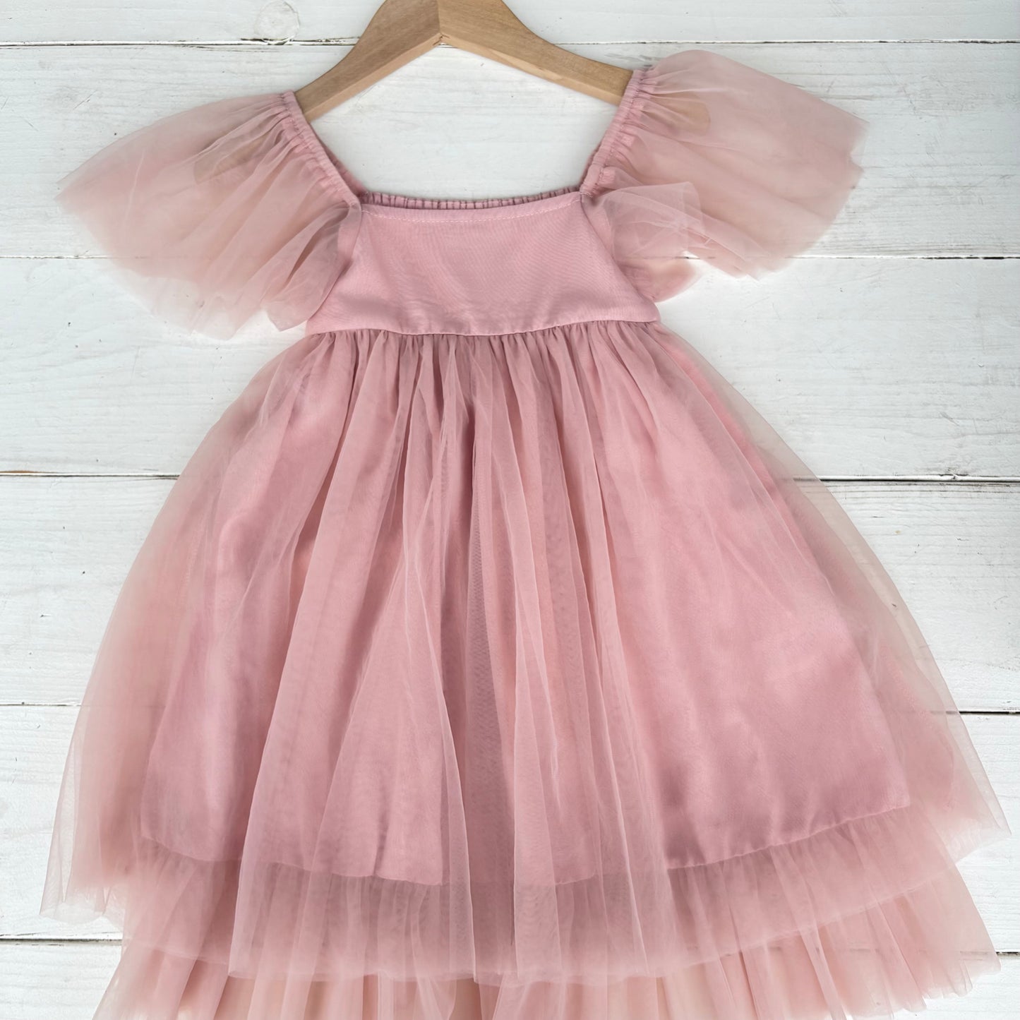 girl's pink dress with tool skirt and short sleeves