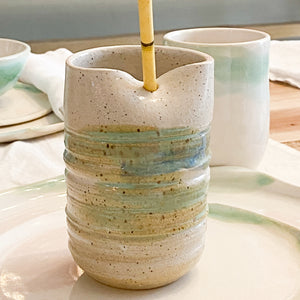 handmade ceramic tumbler with indentation for straw, blue brown and green speckled glazing