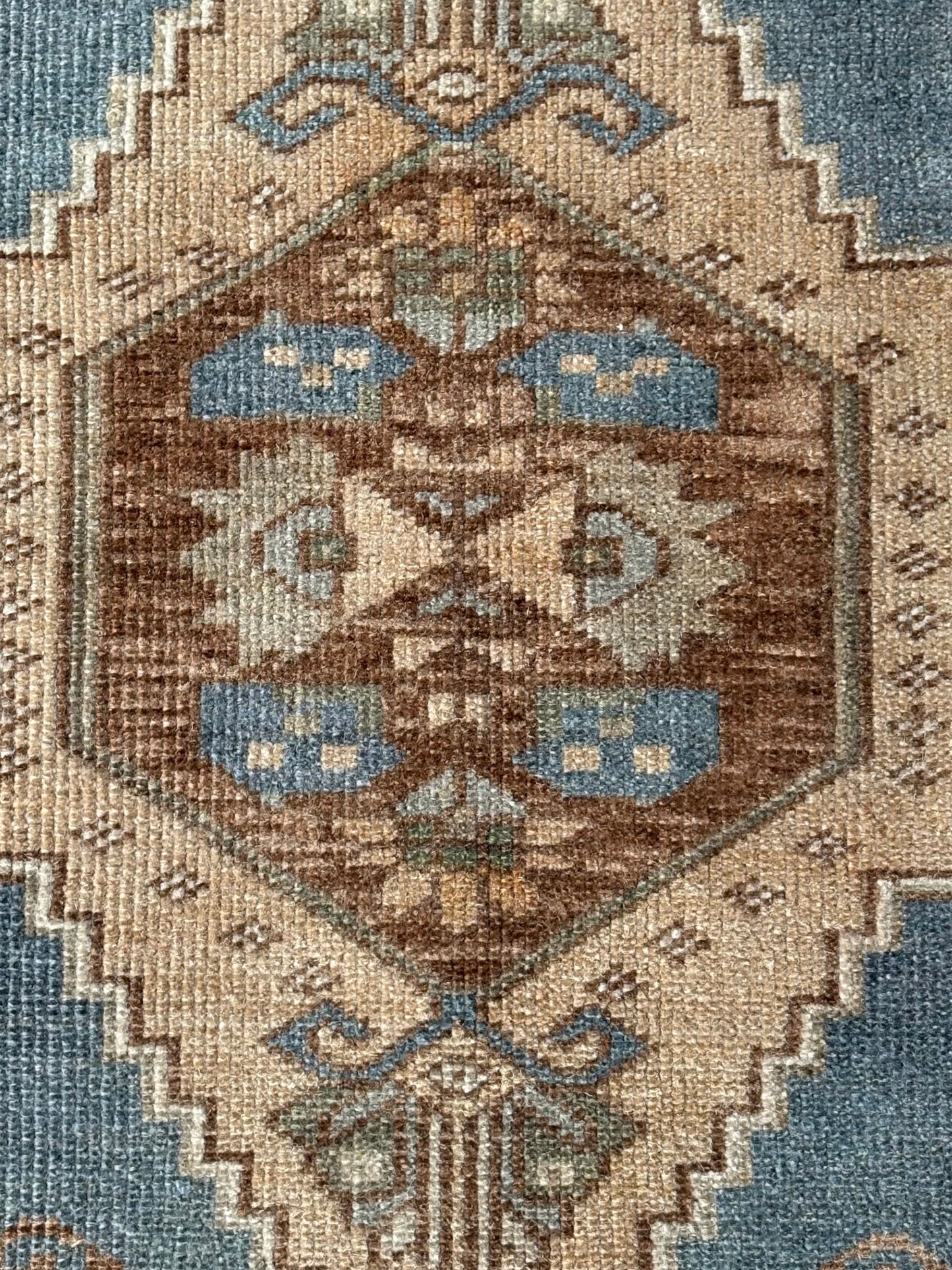 Close-up of a patterned rug with geometric design