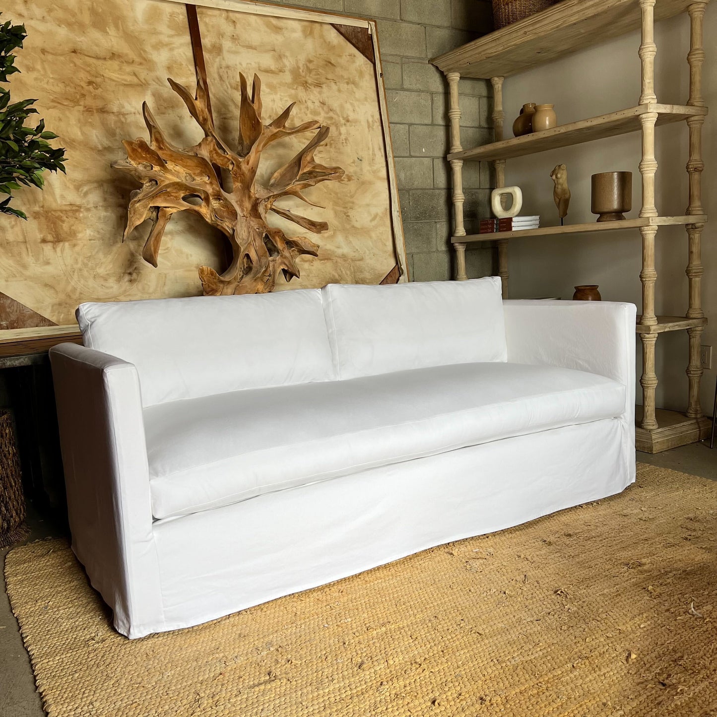 clean line white slip covered sofa