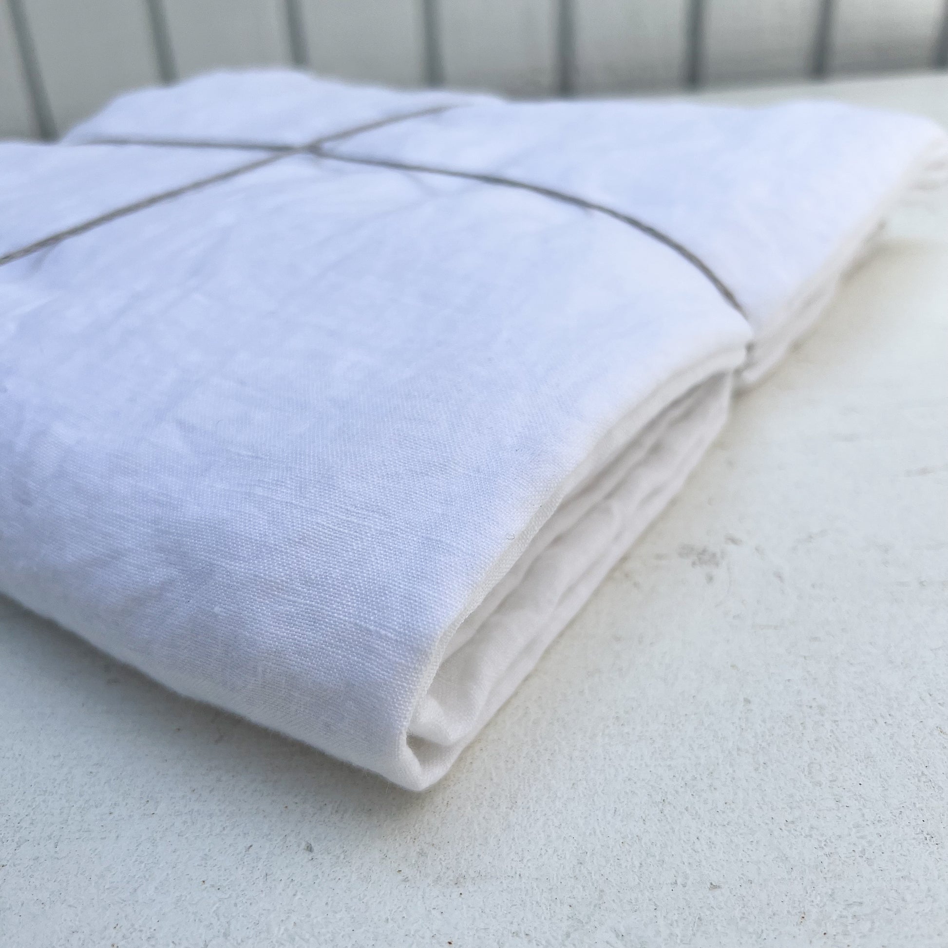 linen white table cloth on wood table