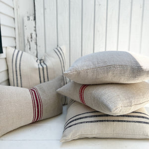 group of different grain sack fabric pillows