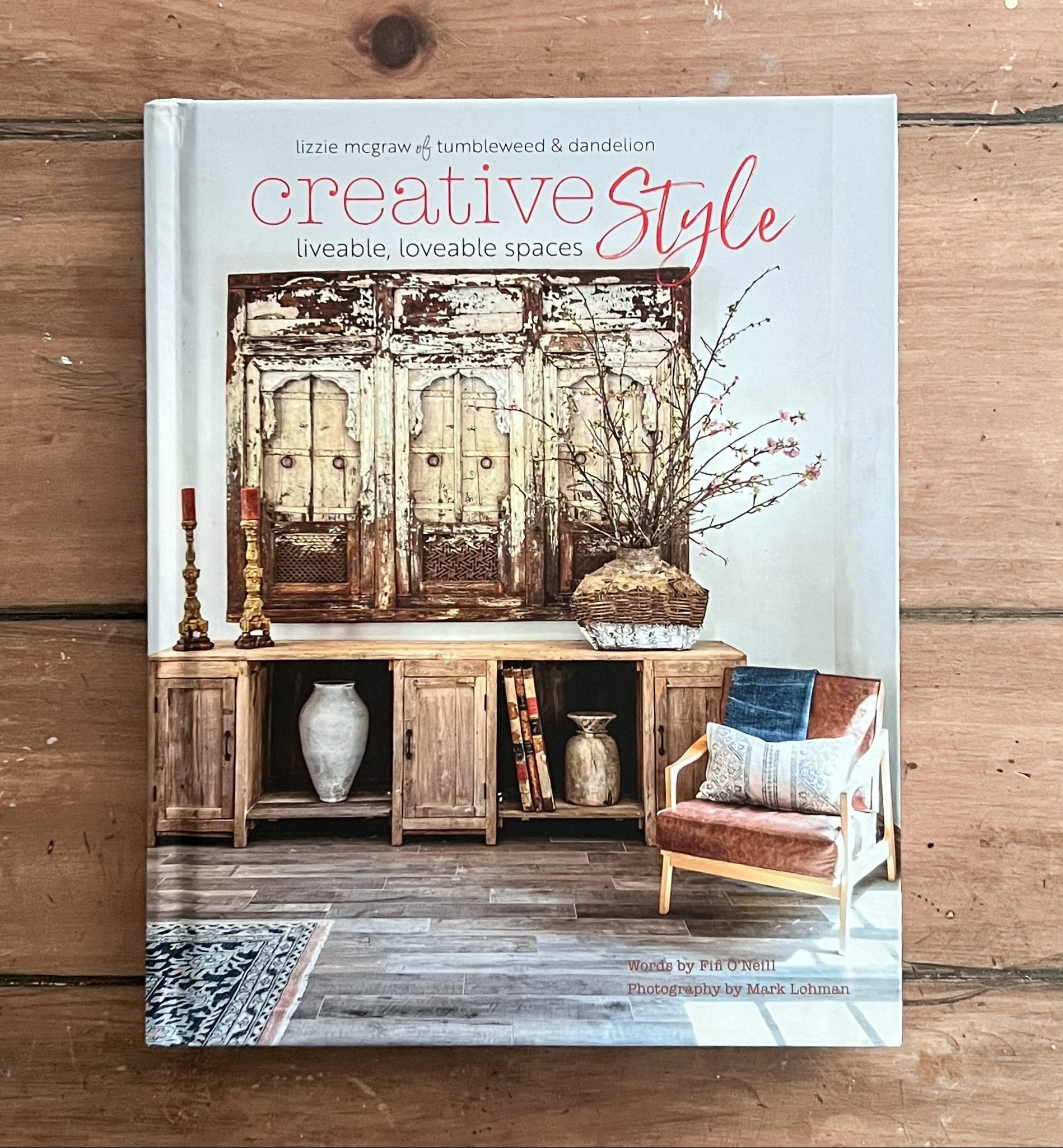 Book titled 'Creative Style' on a wooden surface