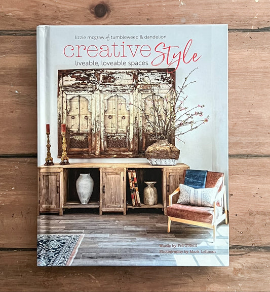 Book titled 'Creative Style' on a wooden surface