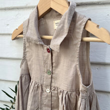 Load image into Gallery viewer, sleeveless tan linen kid&#39;s dress with colored buttons down front and a collar