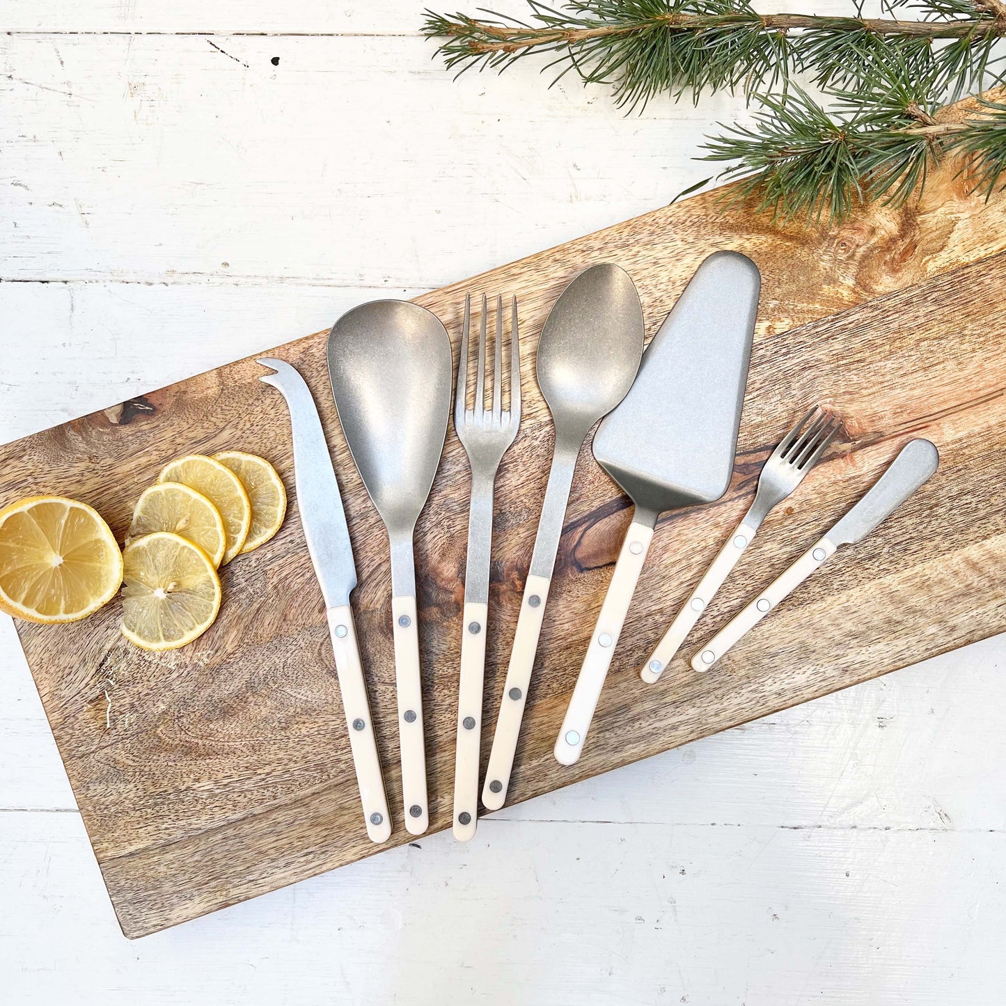 serving flatware pieces on a wood cutting board