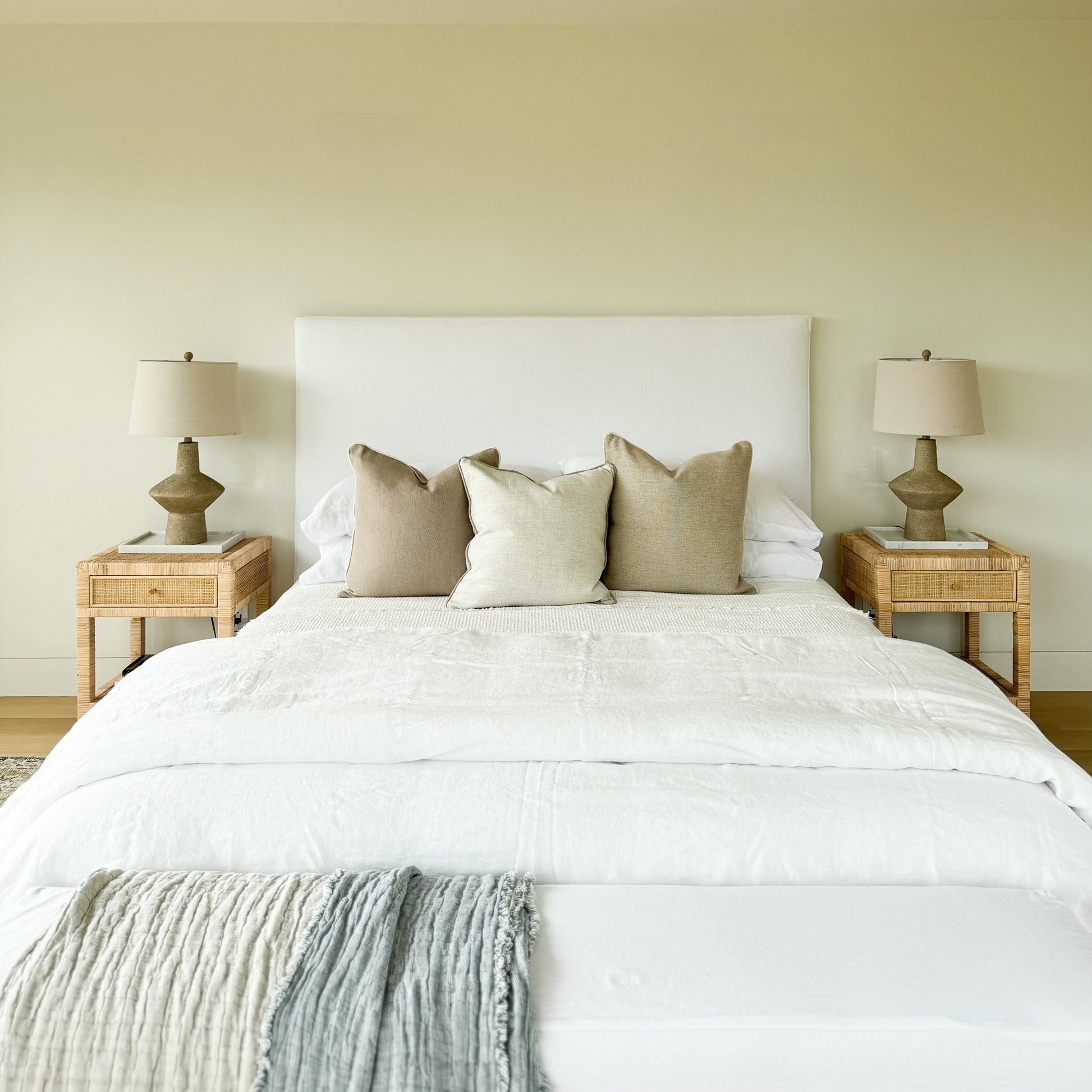 Upholstered bed with white fabric