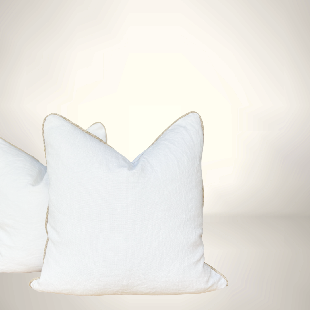 White decorative pillow on a light beige background