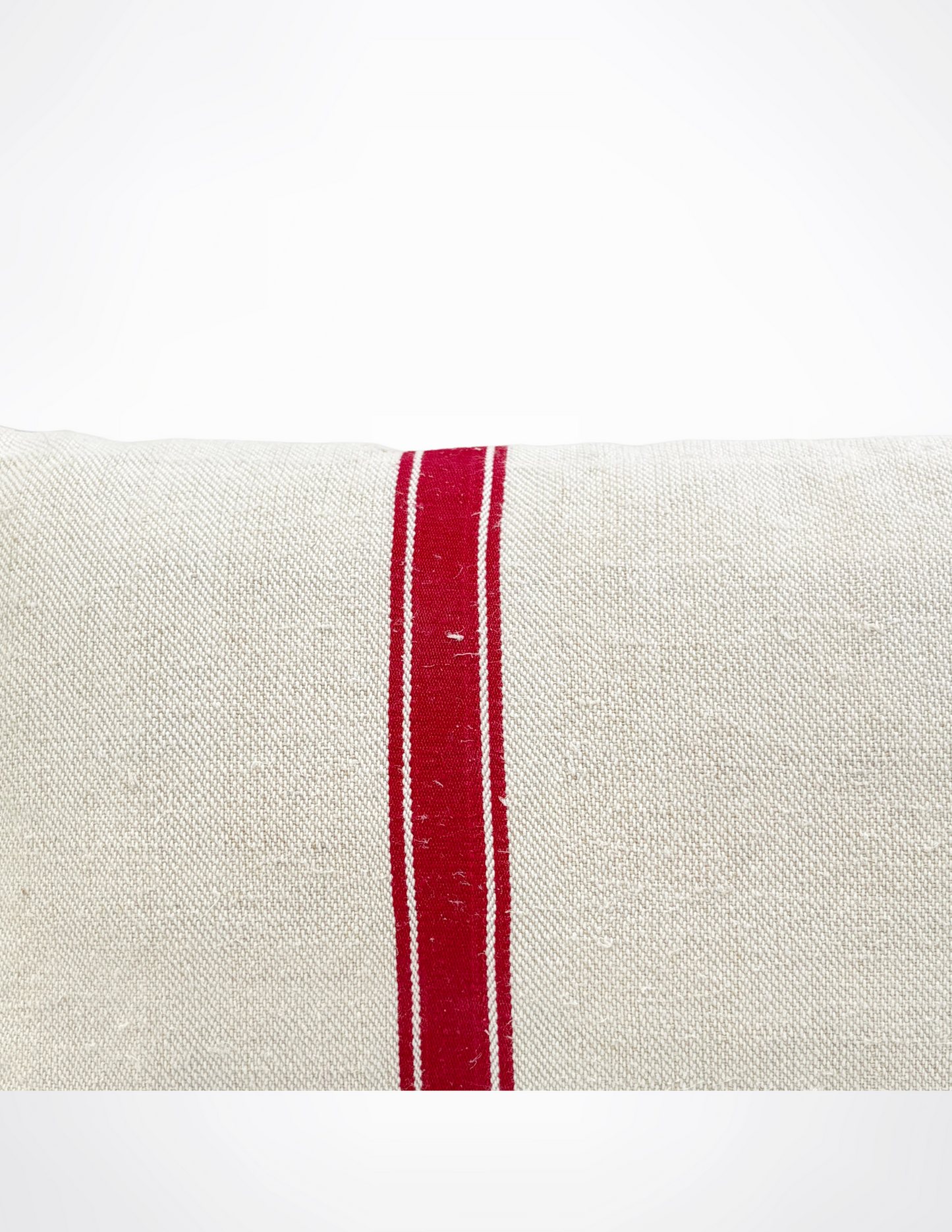 Close-up of a white fabric with a red stripe on a white background