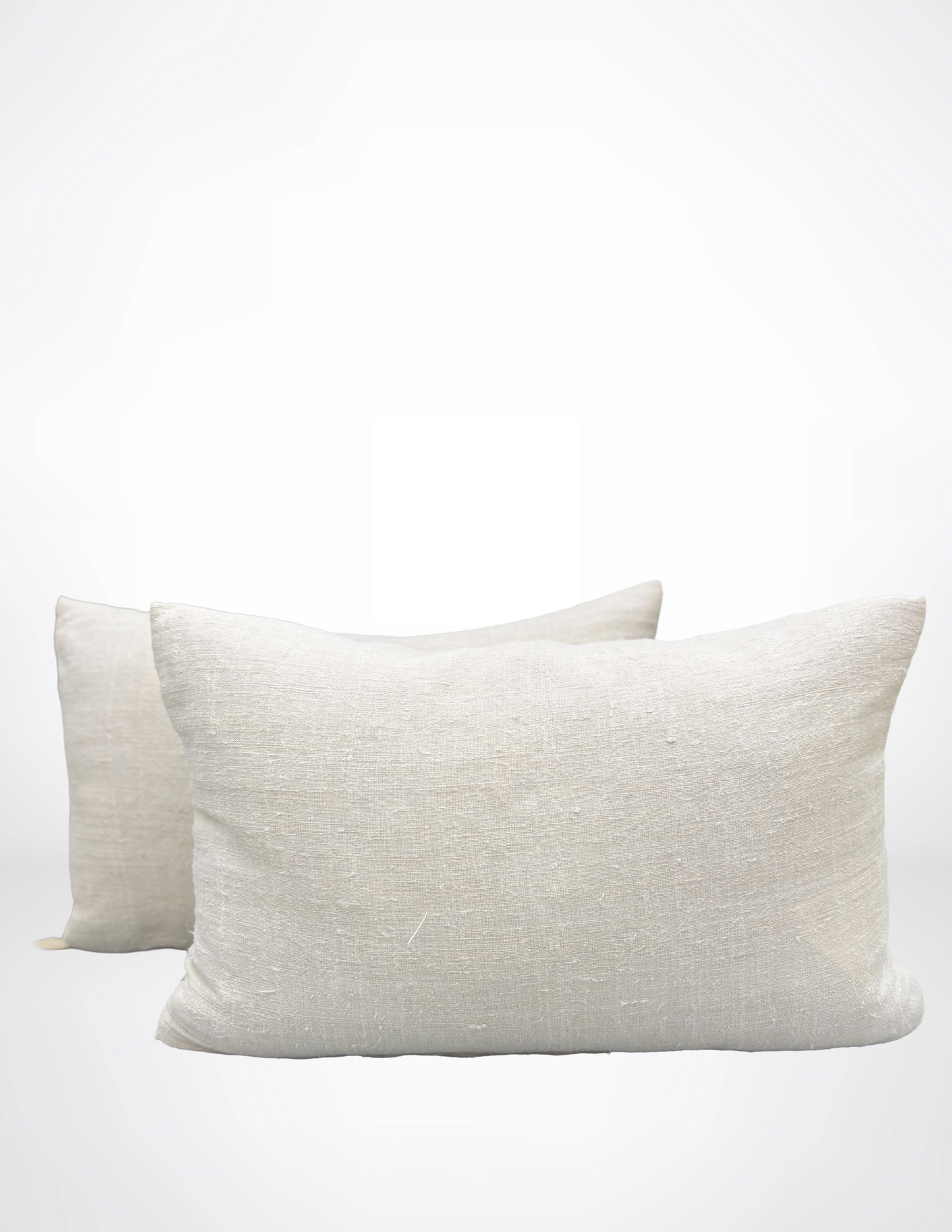 Two white pillows on a white background