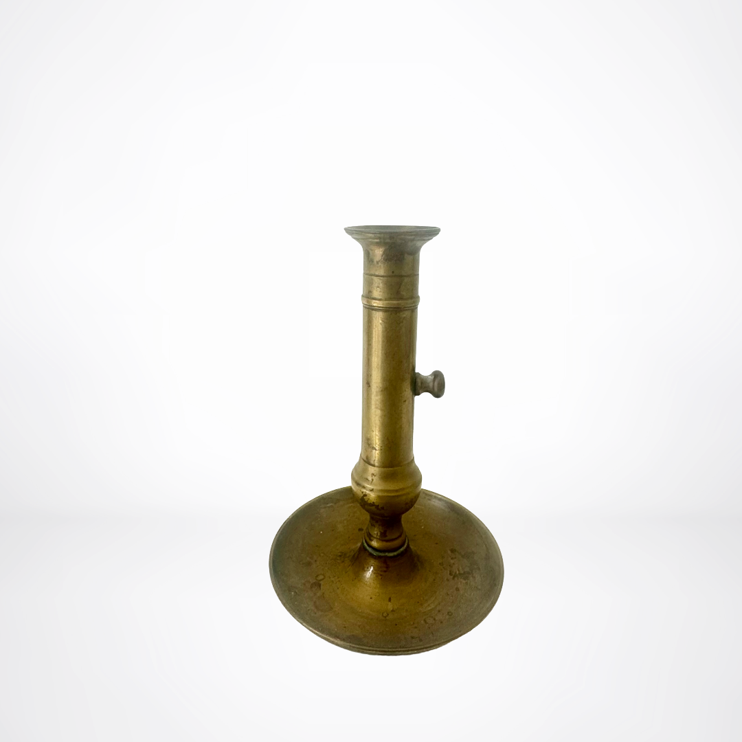 Brass candlestick on a white background