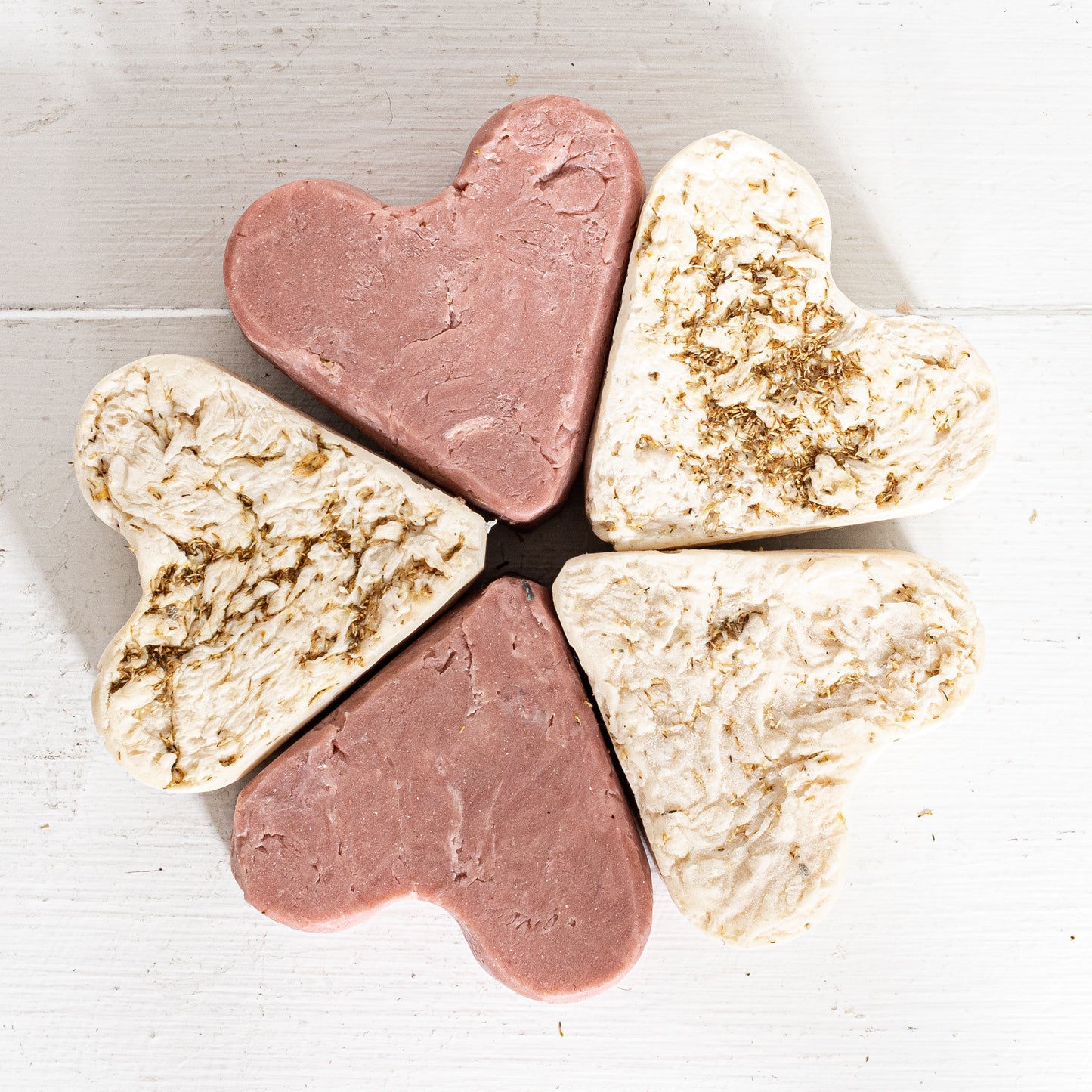 rose colored clay heart shaped soap