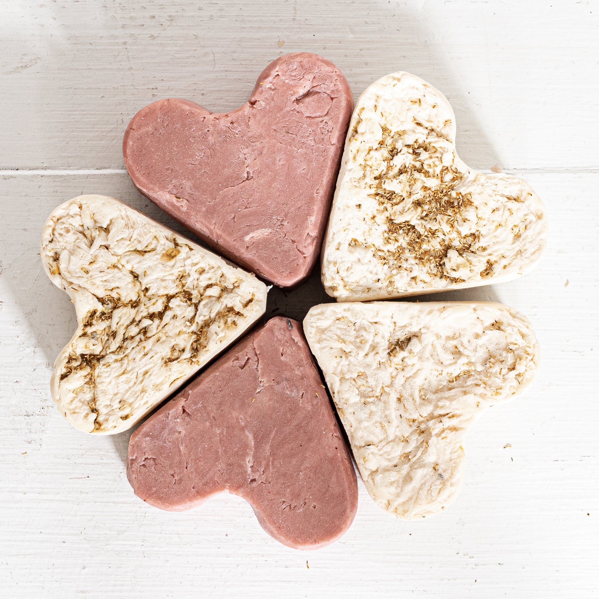 rose colored clay heart shaped soap