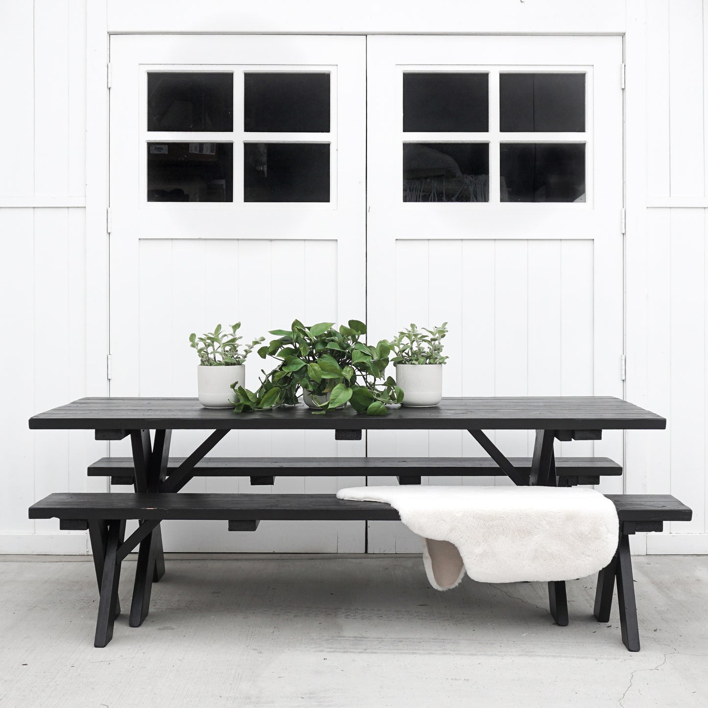 painted wood picnic table and two benches