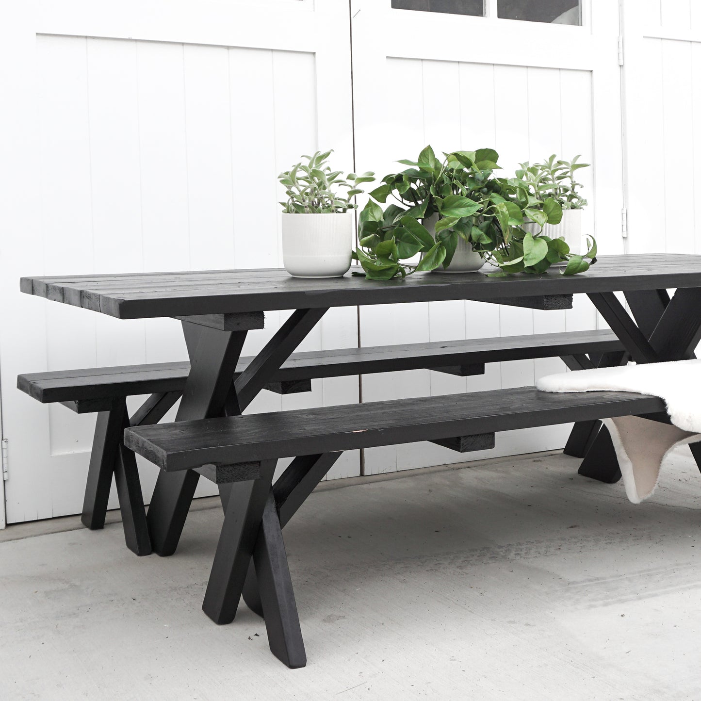 black painted redwood picnic table and benches