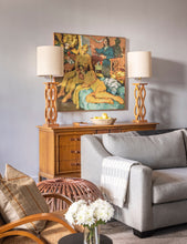 Load image into Gallery viewer, part of a living room, with gray sofa, caramel colored wood credenza, two lamps, colorful painting on wall