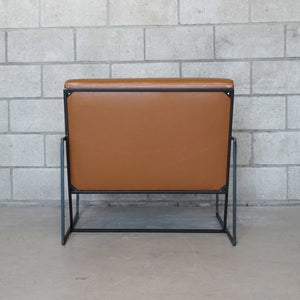brown leather side chair with black metal frame