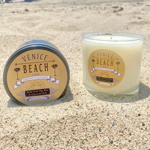 Clear glass candle with tan and black Venice Beach label