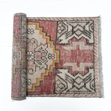Load image into Gallery viewer, brick red, cream, gold, tan and black colored small Turkish rug