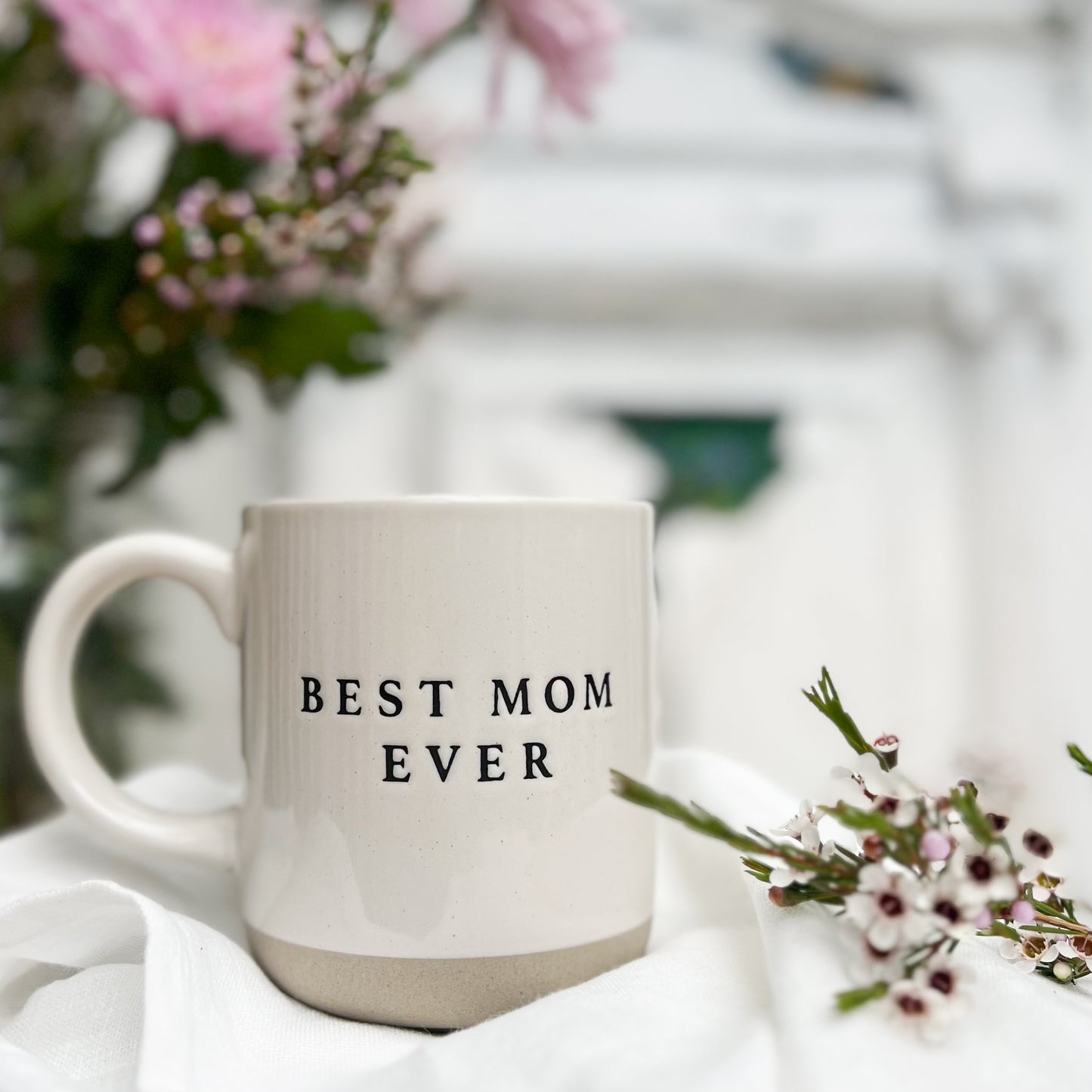 natural colored stoneware mug with "best mom ever" in black letters