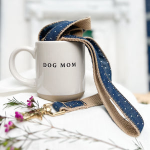 off white stoneware mug with words "dog mom" in black letters