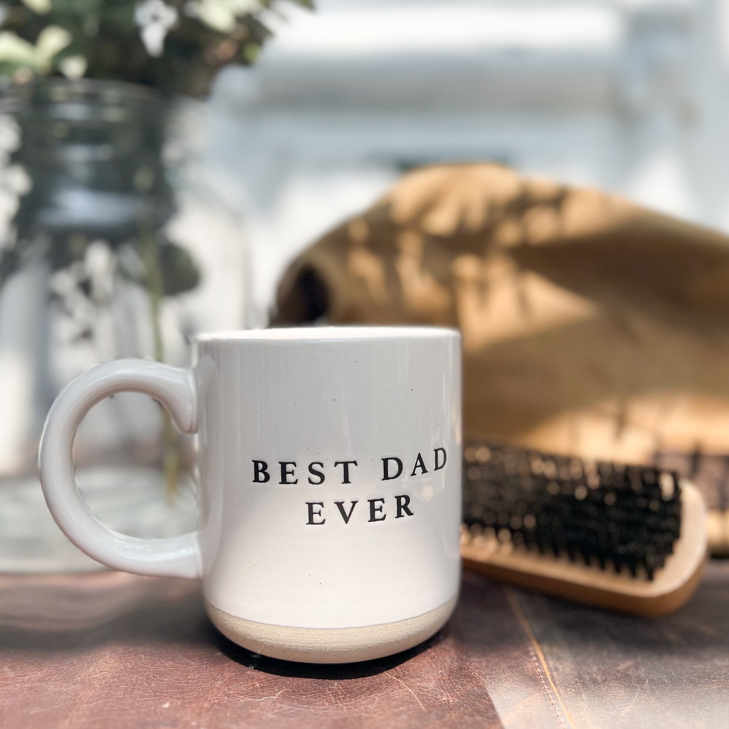 off white stoneware mug with black letters that say "Best Dad Ever"