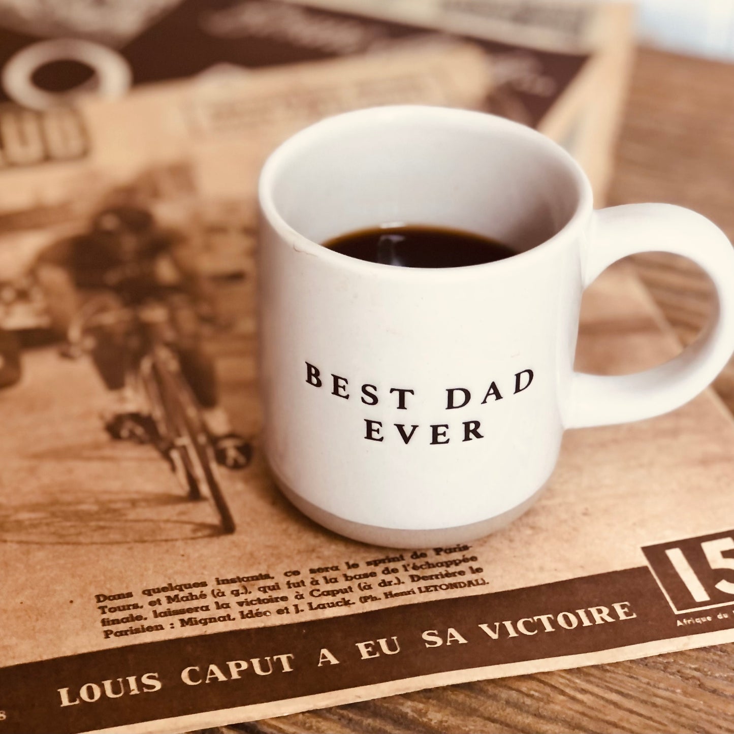 off white stoneware mug with black letters that say "Best Dad Ever"