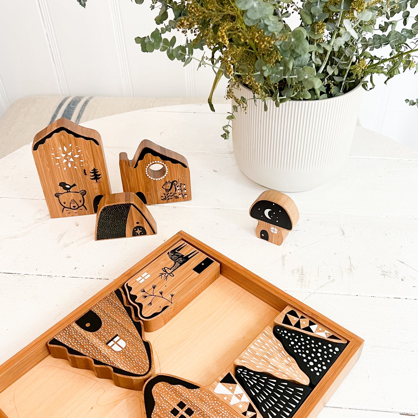 woodland village bamboo baby play set in black, natural wood and white colors