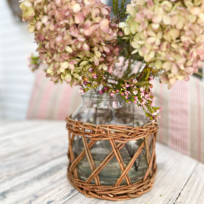 glass jar with rattan wrapped on outside