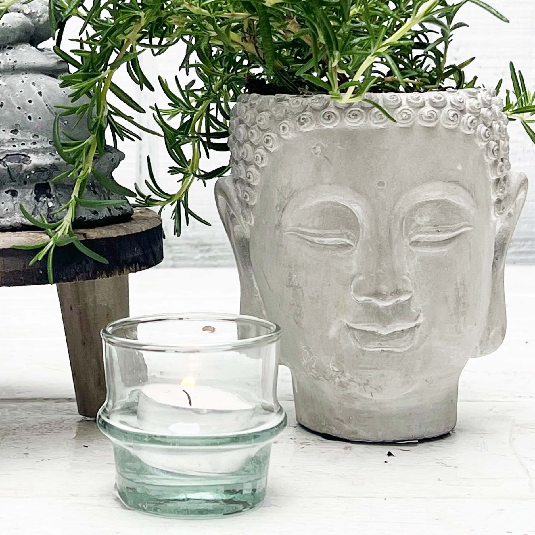stone planter shaped like a Buddha head