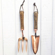 Load image into Gallery viewer, copper fork and trowel garden tool set with wooden handles imprinted with &quot;Tumbleweed&quot; on fork and &quot;Dandelion&quot; on the trowel