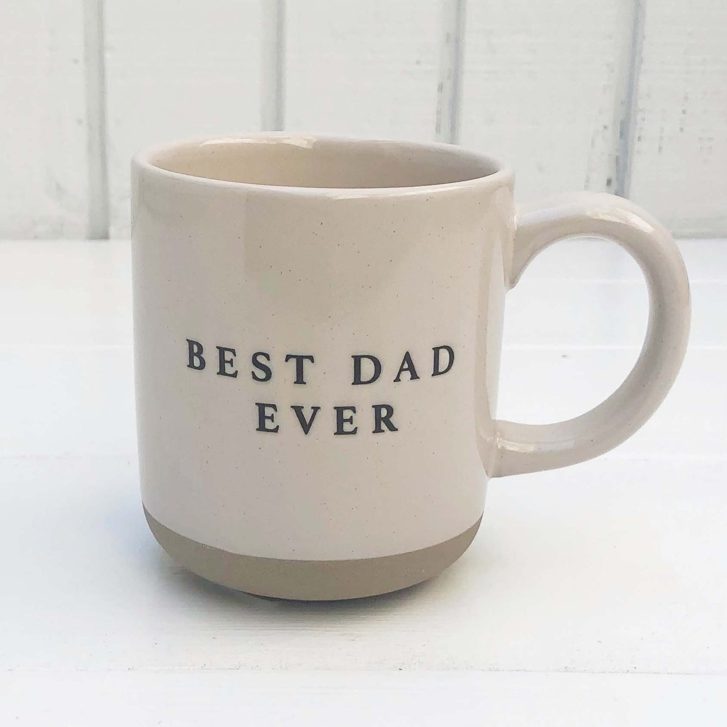 off white stoneware mug with black letters that say "Best Dad Ever"